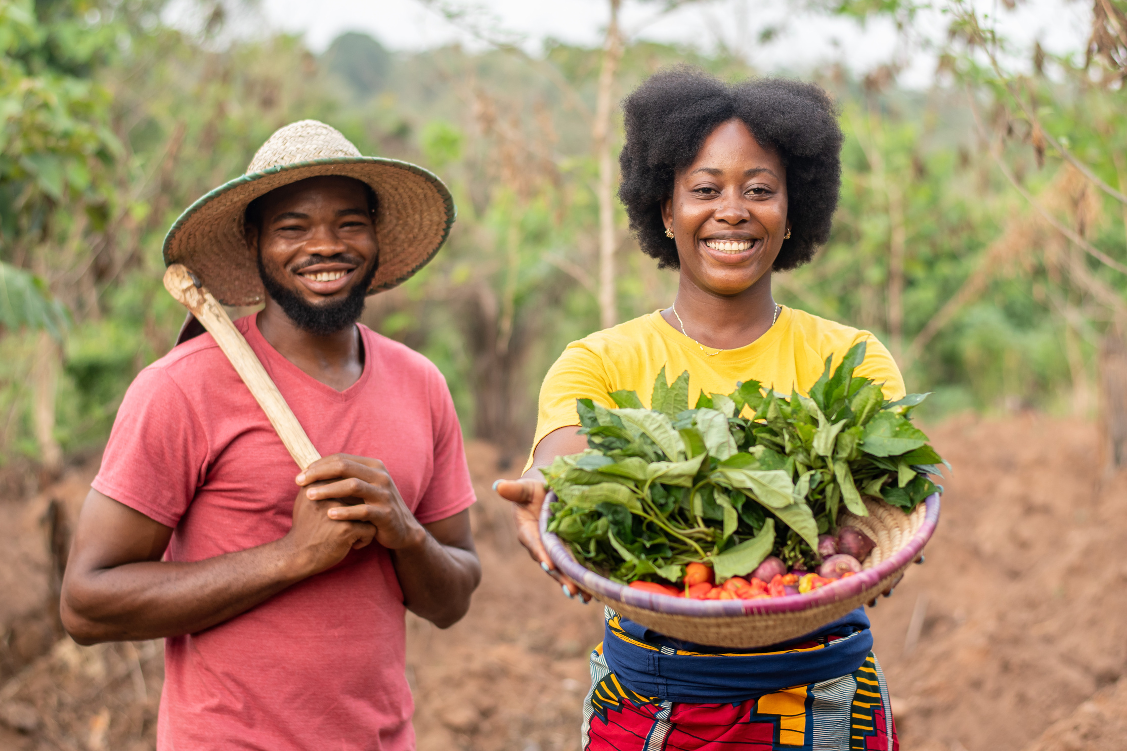 African Farmers Carrying Vegetables and a